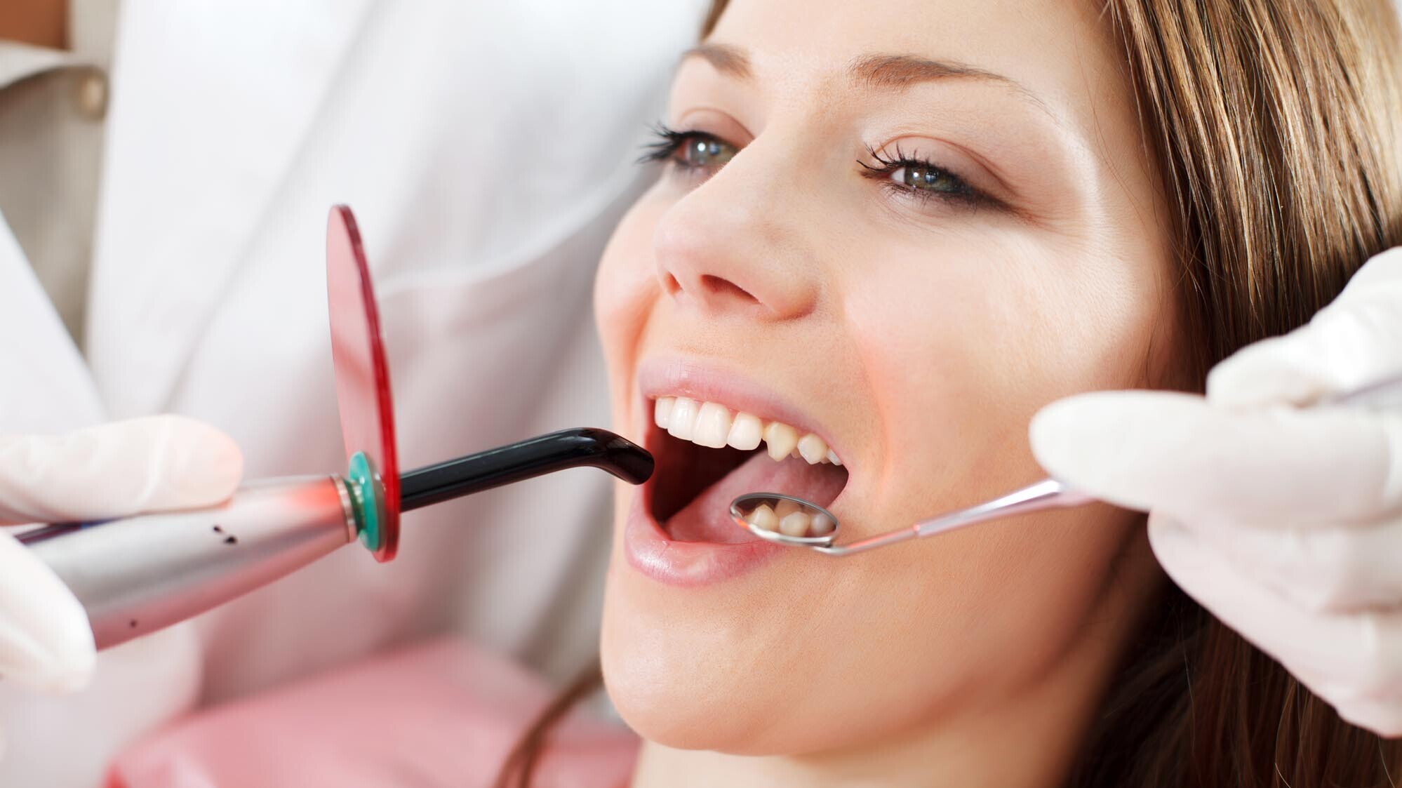 "Beautiful, Adult, Caucasian, Cheerful, Clinic, Close-up, Dental Equipment, Dental Filling, Dentist, Dentist Office, Doctor, Equipment, Examining, Female, Gums", Healthcare And Medicine, Holding, Horizontal, Human Face, Human Mouth, Human Teeth, Indoors, Looking, Medical Exam, Medical Laser, Medical Procedure, Medicine, Mid Adult, Mirror, Nurse, Occupation, Open, Opening, Paramedic, Patient, People, Professional Occupation, Protective Glove, Scrutiny, Sitting, Toothache, Ultraviolet Light, Visit, Women, Young Adult